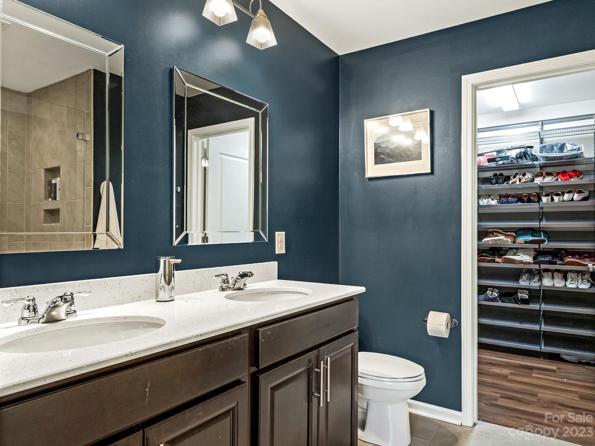907 Wicawa Road Fort Mill, SC 29708 - Photo 17 of 25 a bathroom with a sink a toilet and a mirror