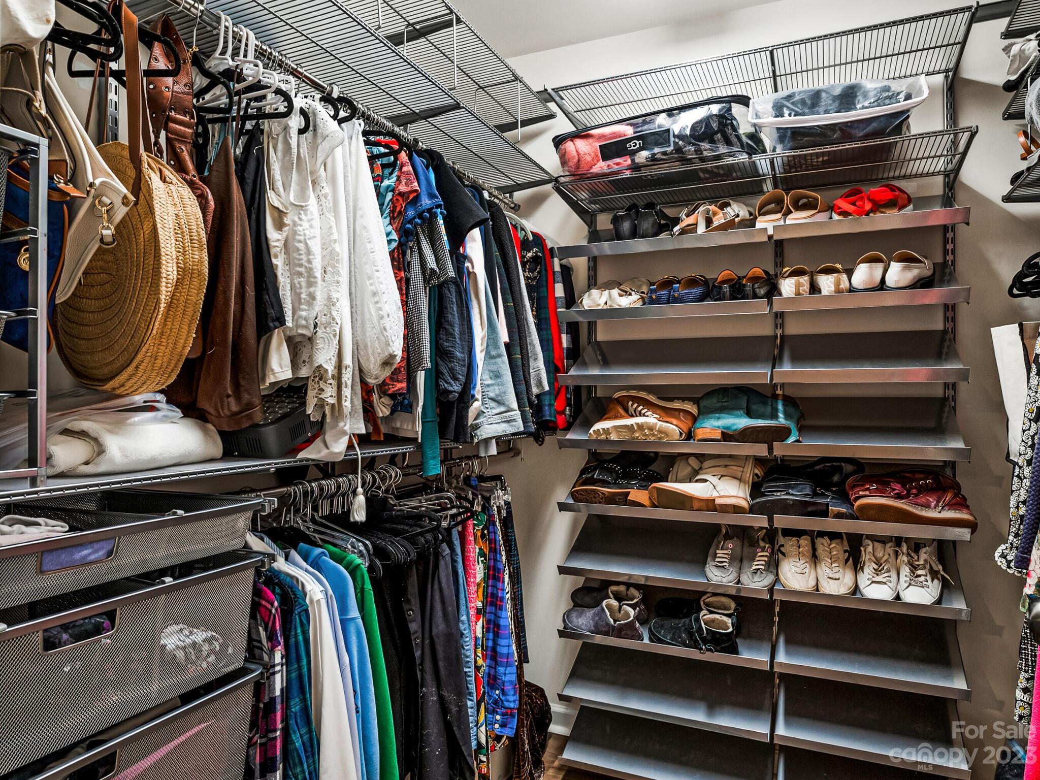 907 Wicawa Road Fort Mill, SC 29708 - Photo 19 of 25 a view of walk in closet with clothes and shoes