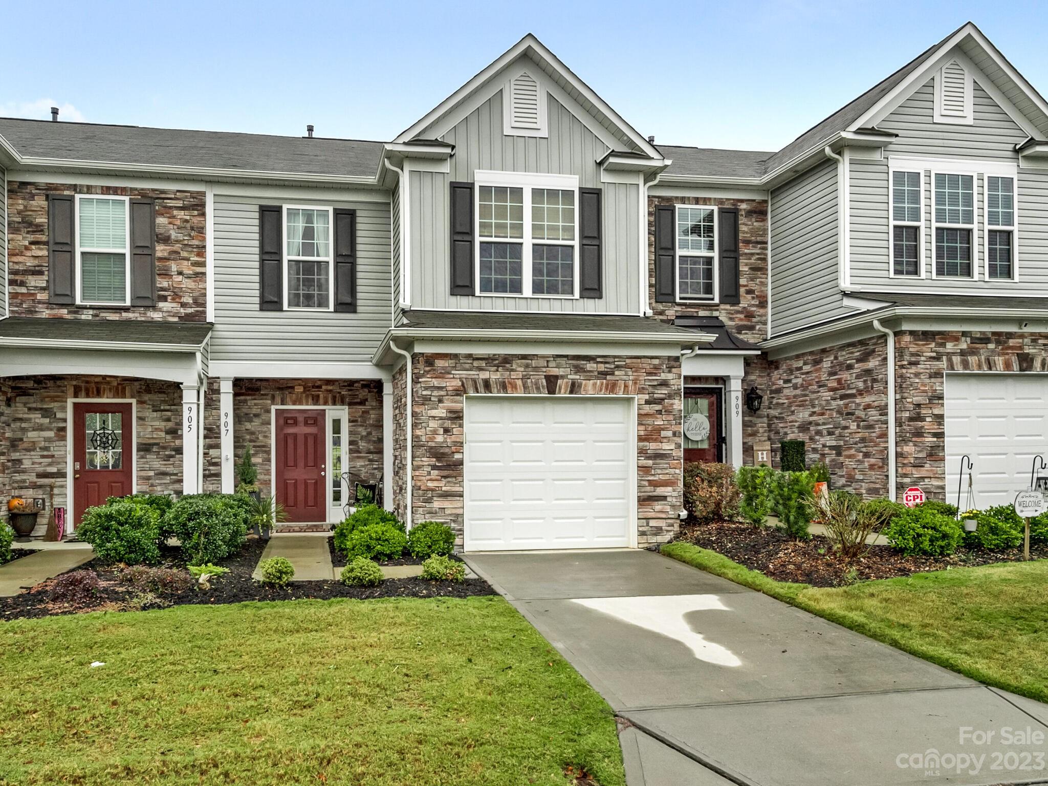 907 Wicawa Road Fort Mill, SC 29708 - Photo 2 of 25 a front view of a house with a yard