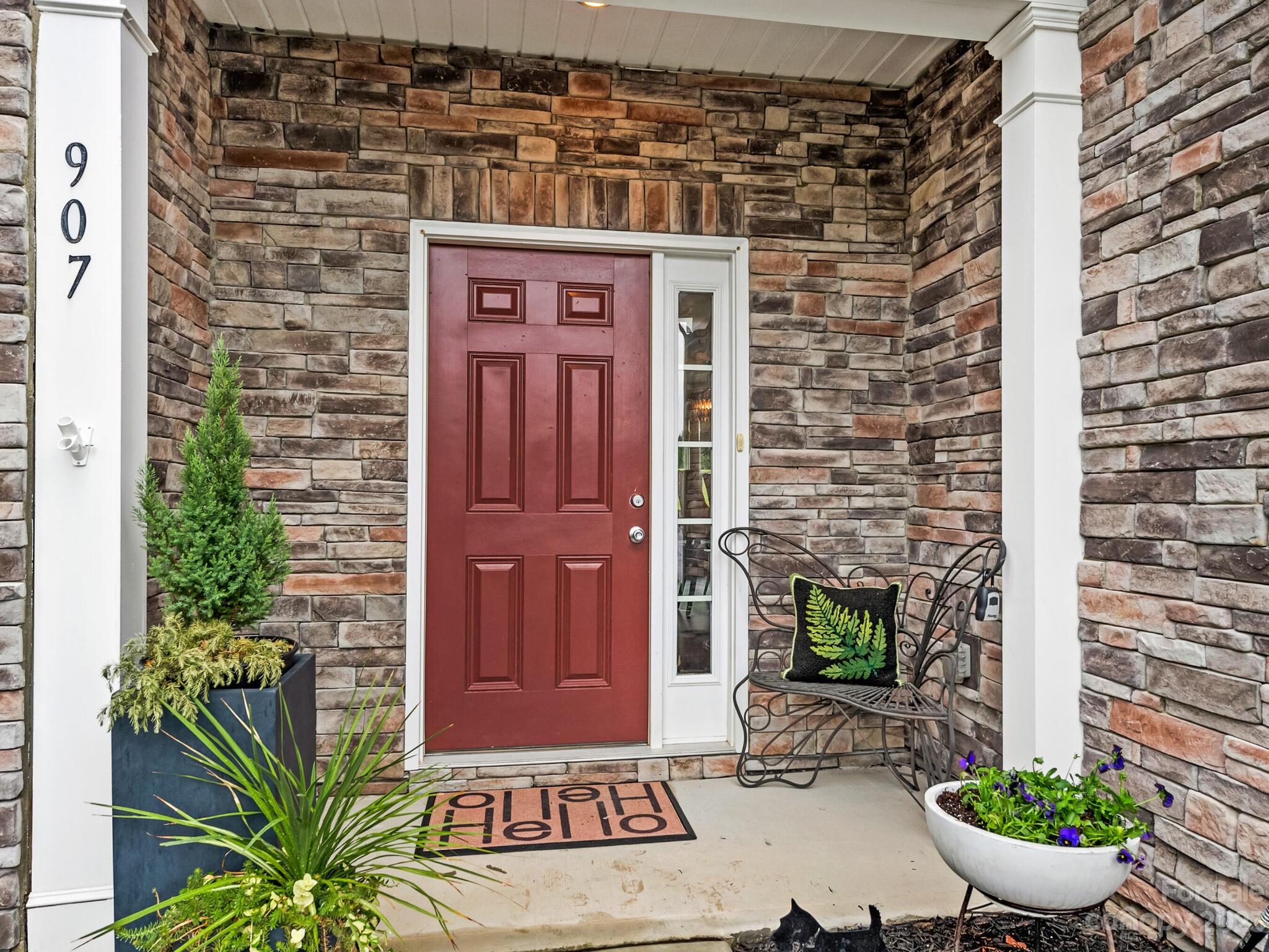 907 Wicawa Road Fort Mill, SC 29708 - Photo 3 of 25 a front view of a house with a potted plant and a potted plant