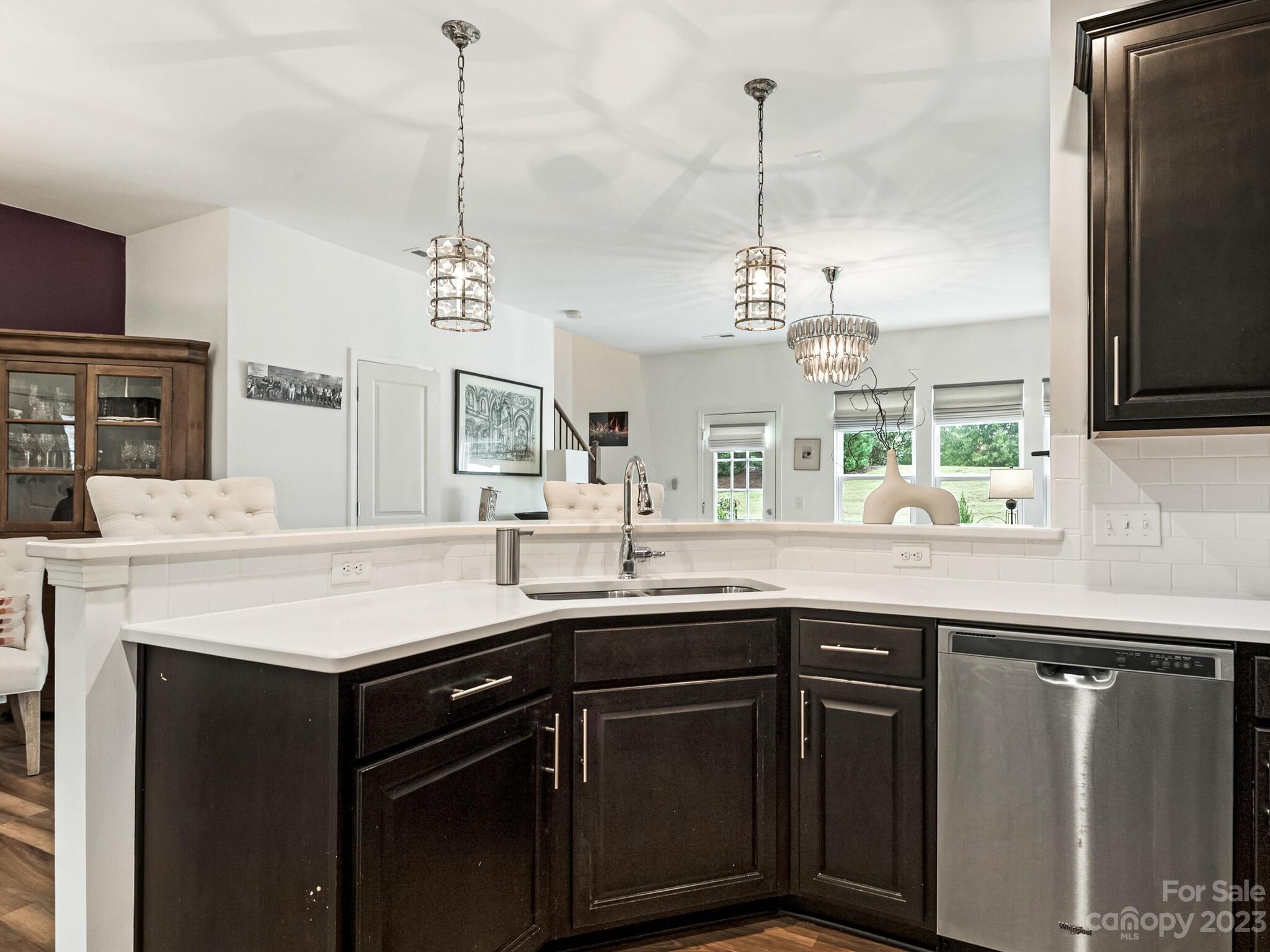 907 Wicawa Road Fort Mill, SC 29708 - Photo 7 of 25 a kitchen with a sink and a refrigerator