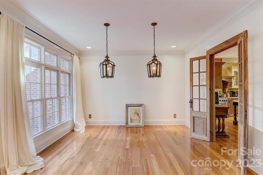 99 Mullally Drive Flat Rock, NC 28731 - Photo 12 of 48 a view of empty room with wooden floor and windows
