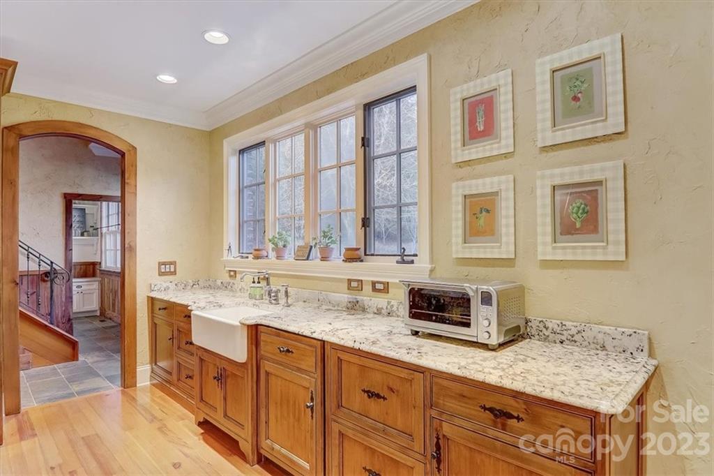 99 Mullally Drive Flat Rock, NC 28731 - Photo 19 of 48 a kitchen with stainless steel appliances granite countertop a sink stove and cabinets