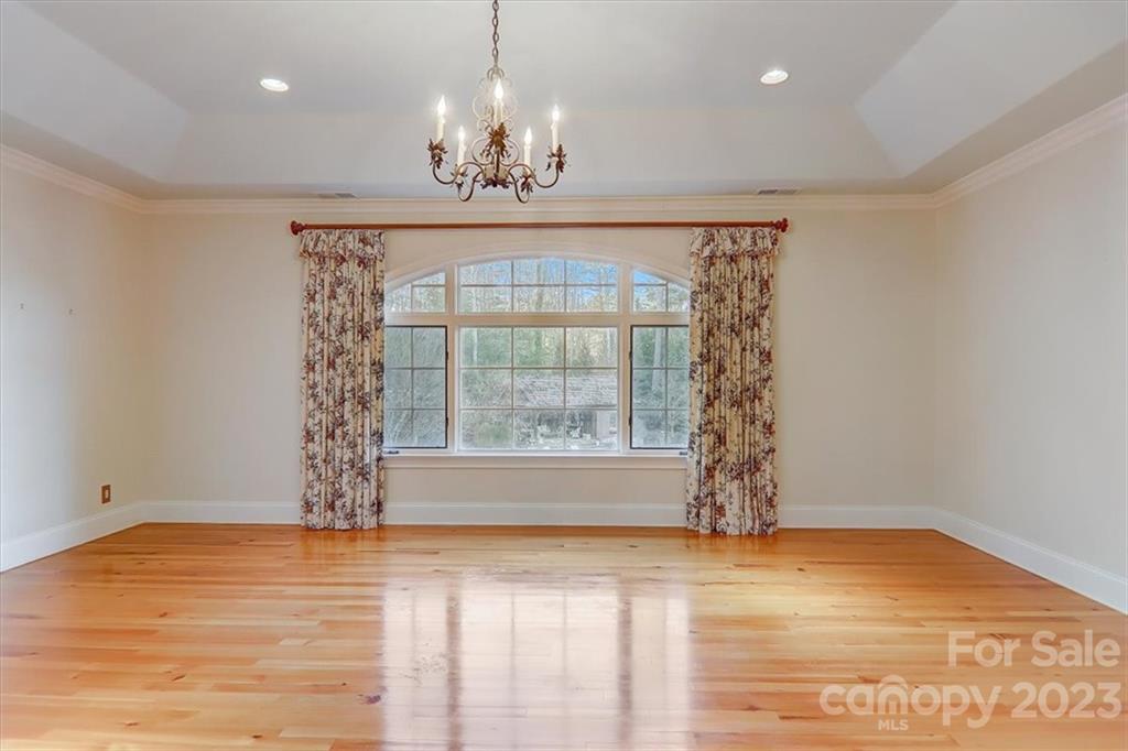 99 Mullally Drive Flat Rock, NC 28731 - Photo 24 of 48 a view of empty room with wooden floor and fan