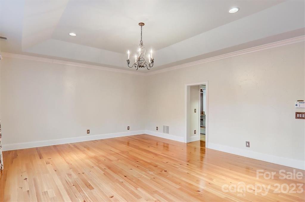 99 Mullally Drive Flat Rock, NC 28731 - Photo 26 of 48 a view of empty room with wooden floor and window