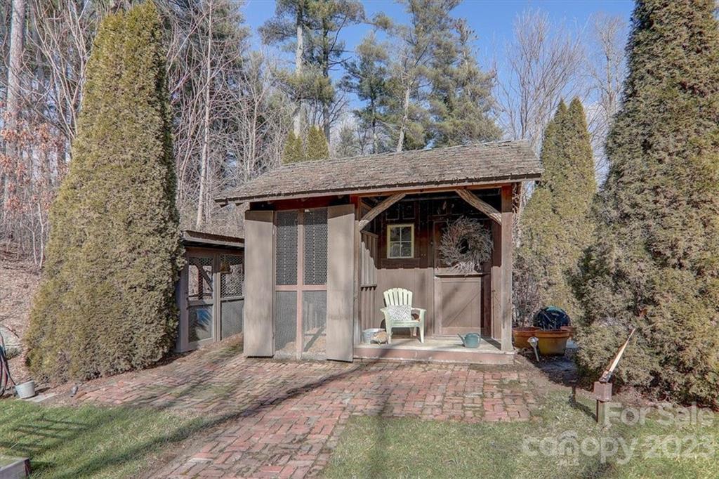 99 Mullally Drive Flat Rock, NC 28731 - Photo 42 of 48 a front view of a house with garden