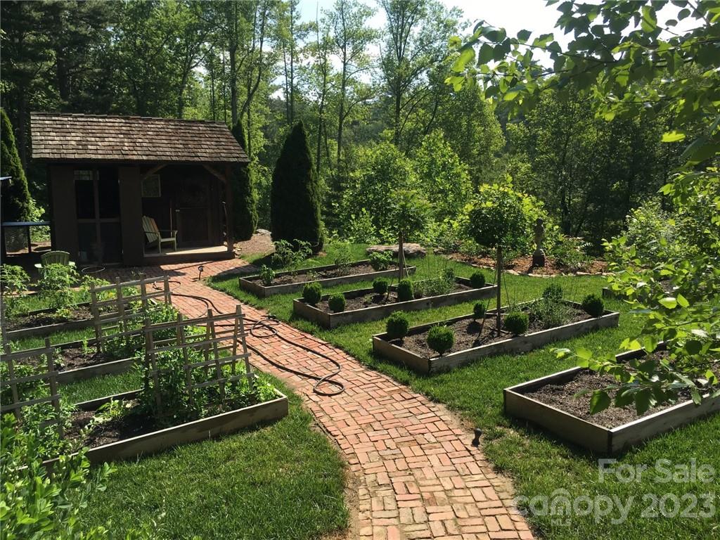 99 Mullally Drive Flat Rock, NC 28731 - Photo 44 of 48 a view of a backyard with sitting area