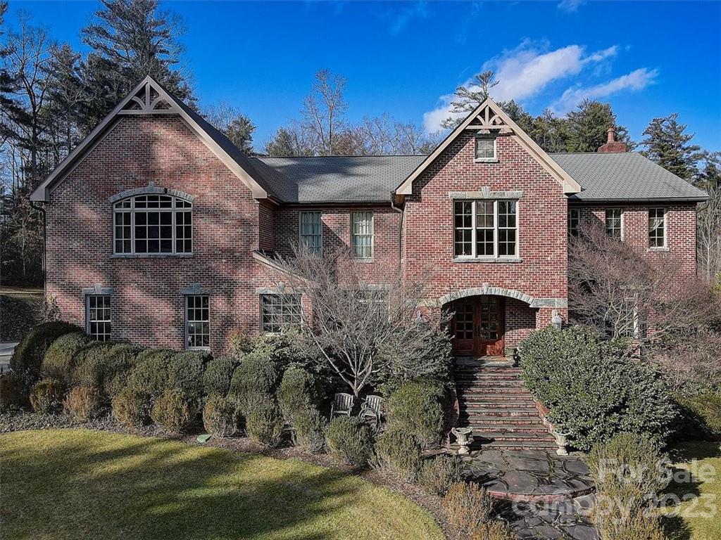 99 Mullally Drive Flat Rock, NC 28731 - Photo 48 of 48 a front view of a house with a yard