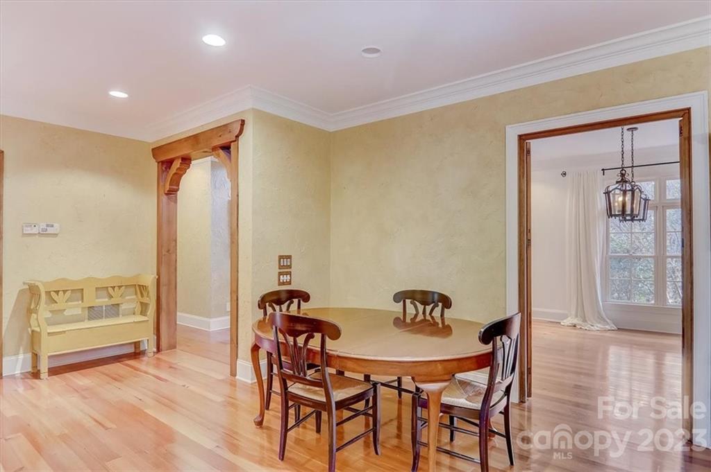 99 Mullally Drive Flat Rock, NC 28731 - Photo 9 of 48 a view of a dining room with furniture and wooden floor