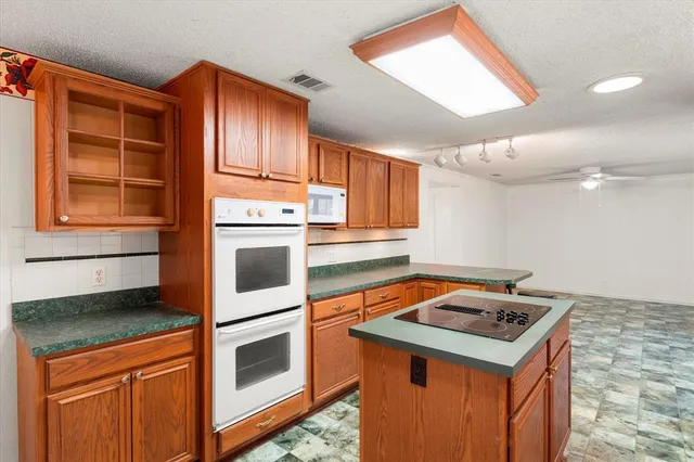 a kitchen with a stove and a microwave