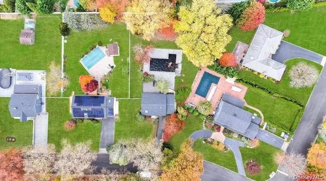 an aerial view of houses with outdoor space