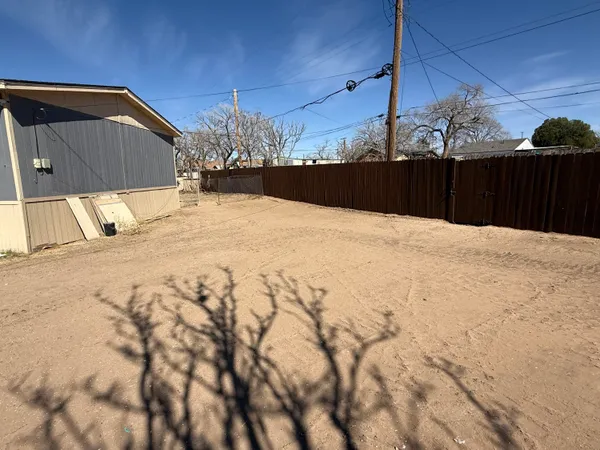 a view of a backyard of a house
