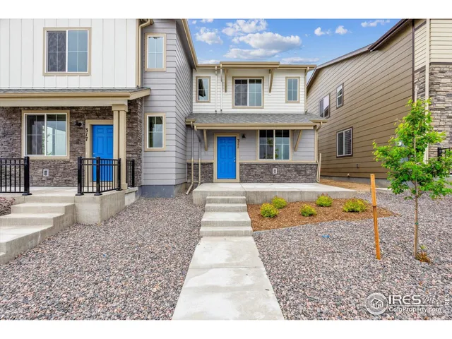 a view of house with swimming pool and sitting area