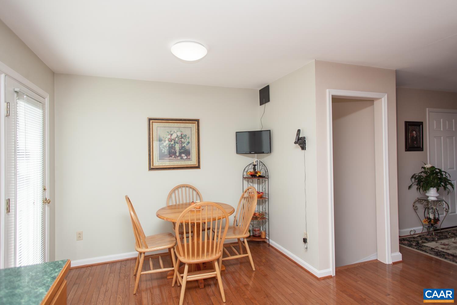 473 Reva Lane Ruckersville, VA 22968 - Photo 17 of 42 a view of a dining room with furniture and wooden floor
