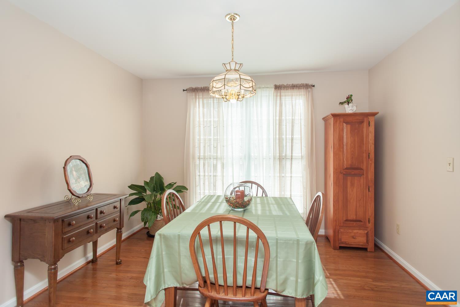 473 Reva Lane Ruckersville, VA 22968 - Photo 18 of 42 a view of a dining room with furniture window and wooden floor