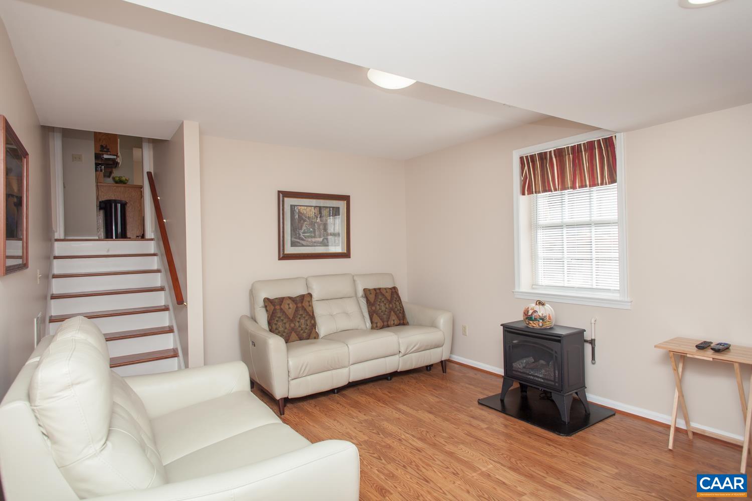 473 Reva Lane Ruckersville, VA 22968 - Photo 27 of 42 a living room with furniture and a wooden floor
