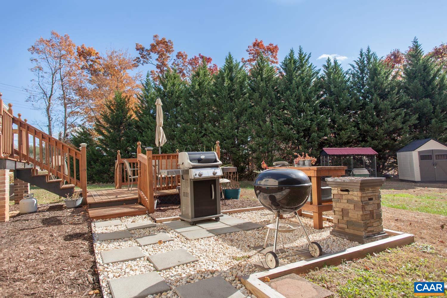 473 Reva Lane Ruckersville, VA 22968 - Photo 40 of 42 a backyard of a house with yard fire pit and outdoor seating