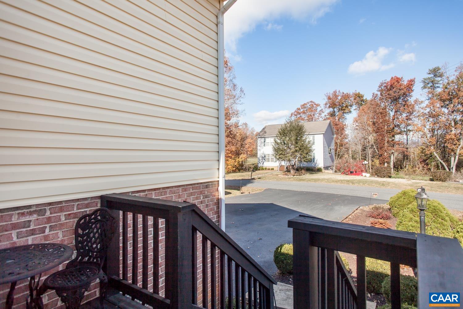 473 Reva Lane Ruckersville, VA 22968 - Photo 4 of 42 a view of balcony with wooden floor and fence