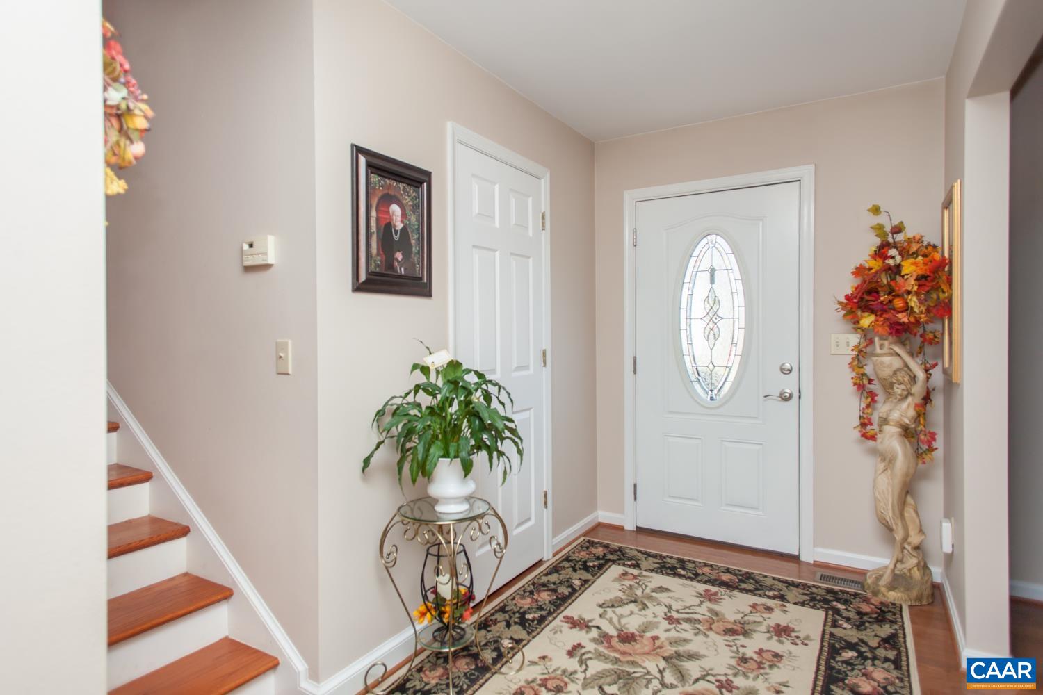 473 Reva Lane Ruckersville, VA 22968 - Photo 6 of 42 a view of a hallway with entryway with paintings on the wall