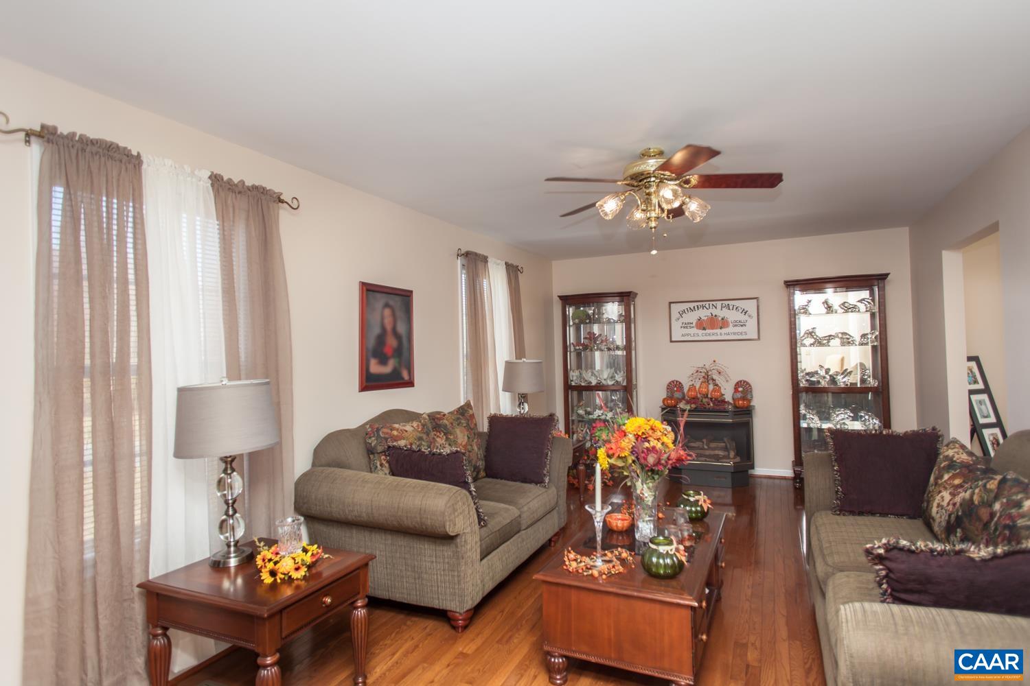 473 Reva Lane Ruckersville, VA 22968 - Photo 9 of 42 a living room with furniture and a chandelier