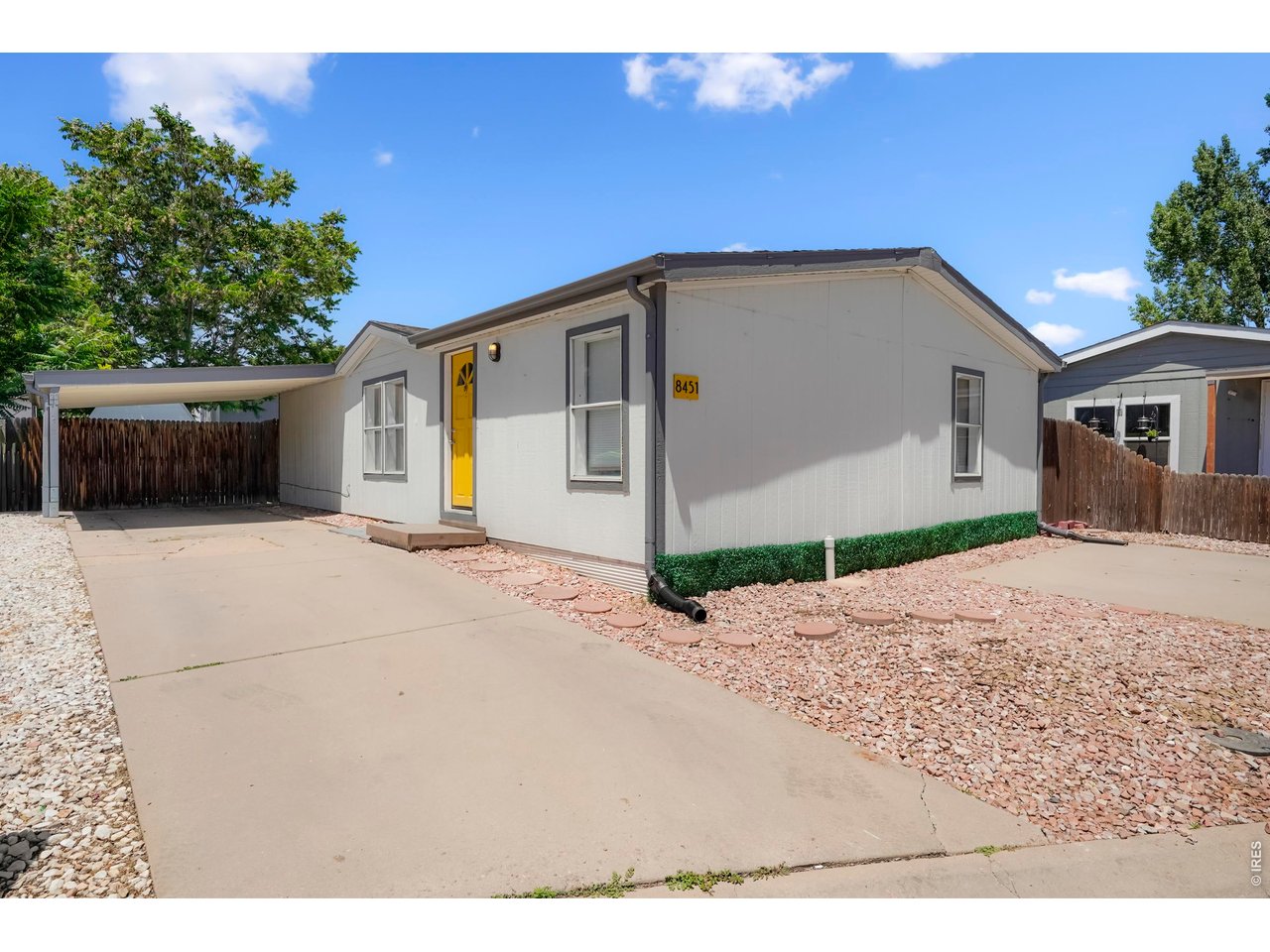 8451 Madison Way Denver, CO 80229 - Photo 1 of 27 Front of Home, Carport and Additional Parking