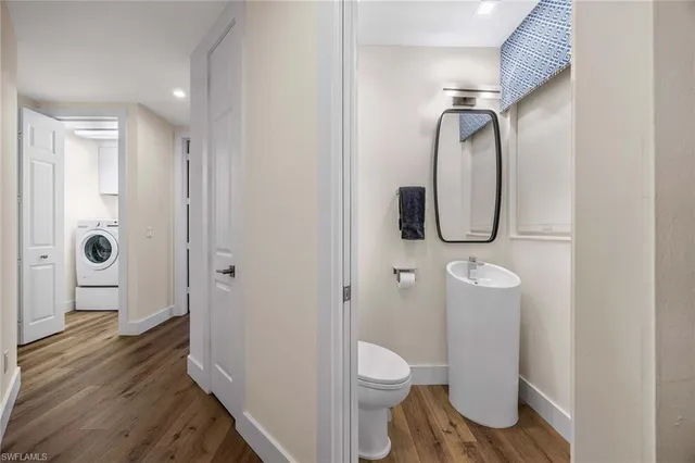 a bathroom with a toilet and a mirror