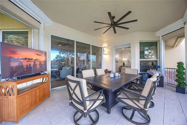 a view of a livingroom with furniture and a flat screen tv