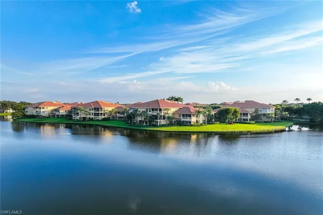 a view of a lake with houses with outdoor space