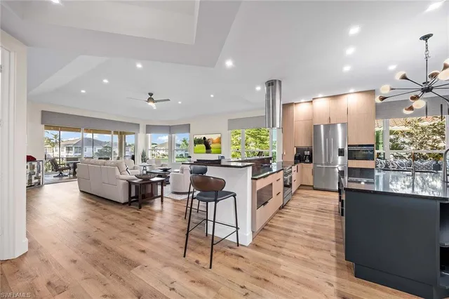 a large kitchen with lots of counter space and windows
