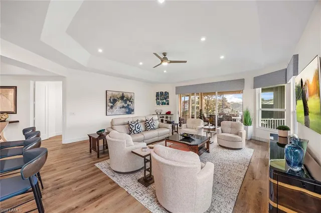 a living room with fireplace furniture and a flat screen tv