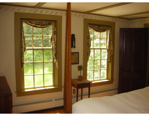 173 Mountain Road Princeton, MA 01541 - Photo 8 of 15 a bedroom with a window and a table