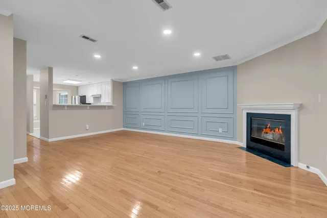 a view of empty room with a fireplace