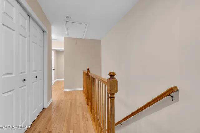 a view of a room with wooden floor