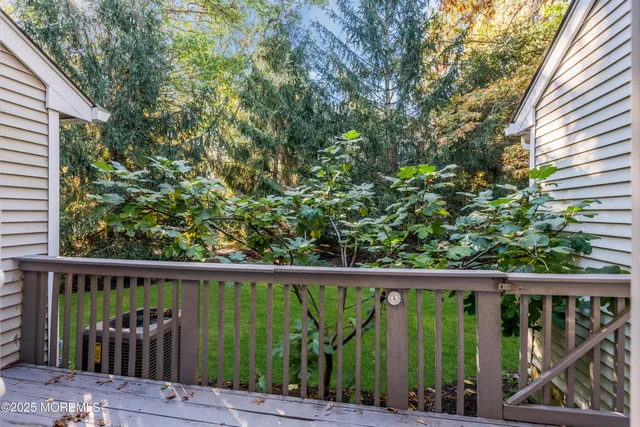 a view of a balcony with wooden floor