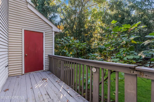 a view of balcony with wooden floor