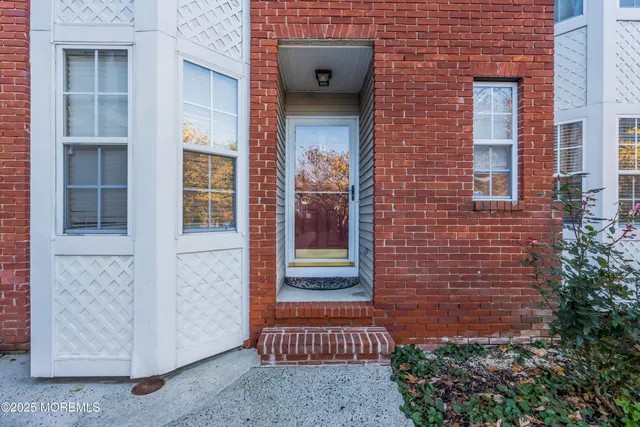 a front view of a house with a door and a window