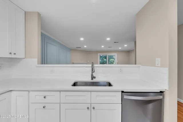 a sink with a white wall