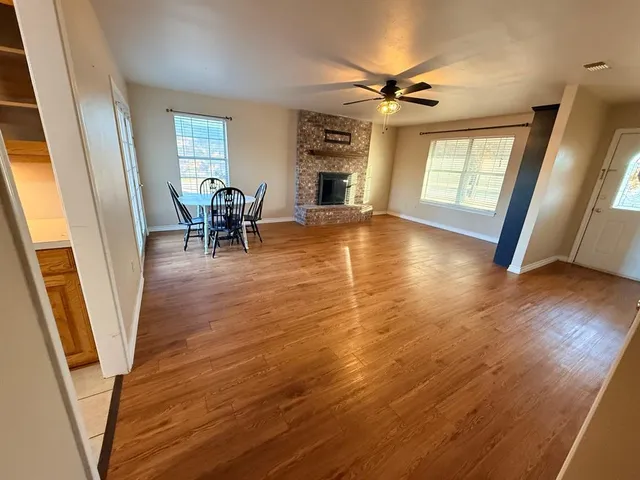 a view of a livingroom with furniture hardwood floor and staircase