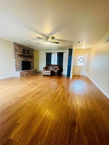 a view of a livingroom with furniture and a fireplace