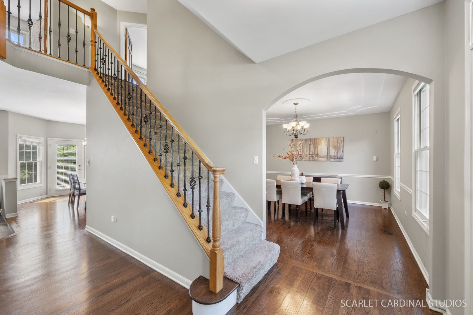 2632 Sweetbroom Road Naperville, IL 60564 - Photo 12 of 33 a view of a dining room with wooden floor windows and a chandelier