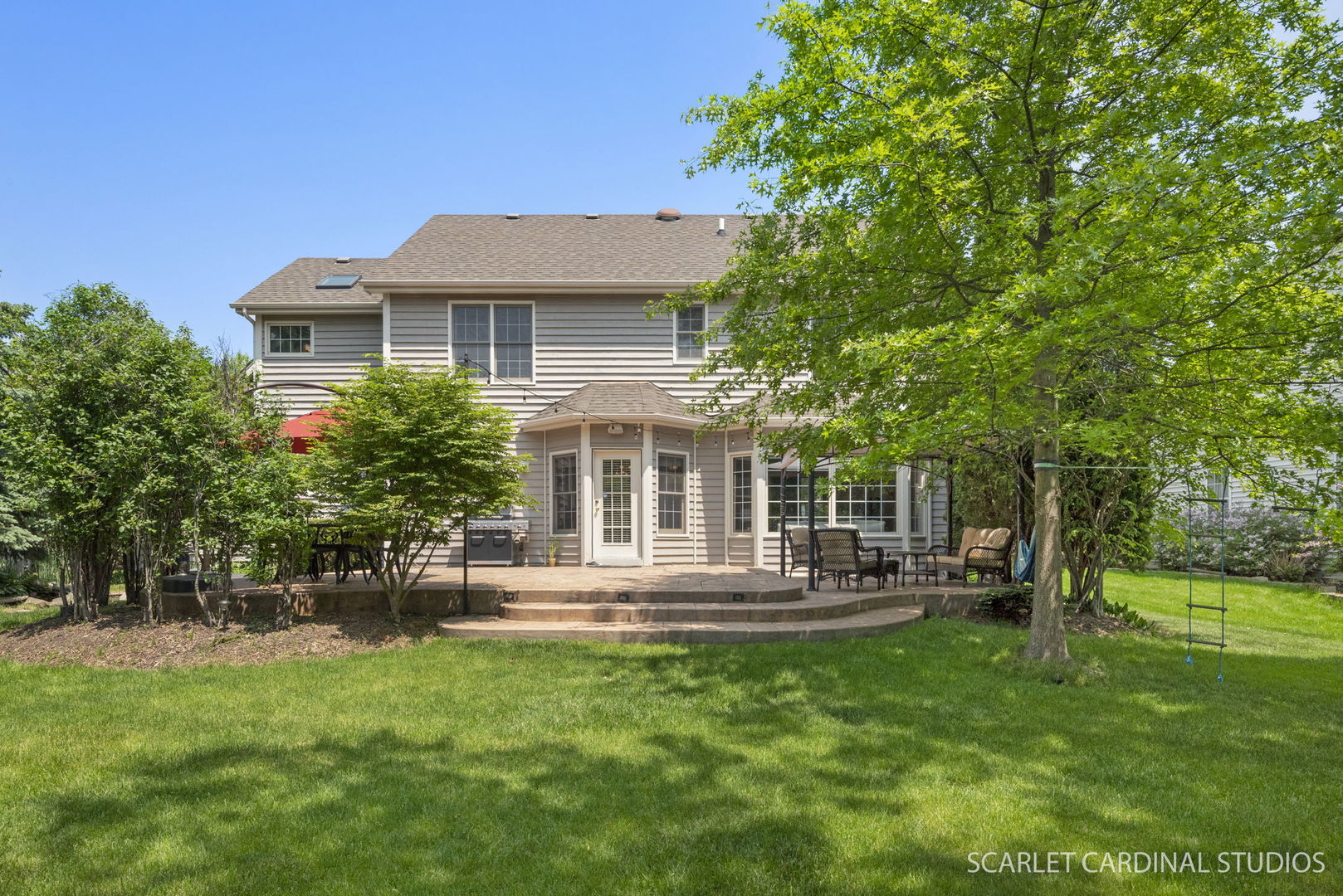 2632 Sweetbroom Road Naperville, IL 60564 - Photo 29 of 33 a front view of a house with a yard table and chairs