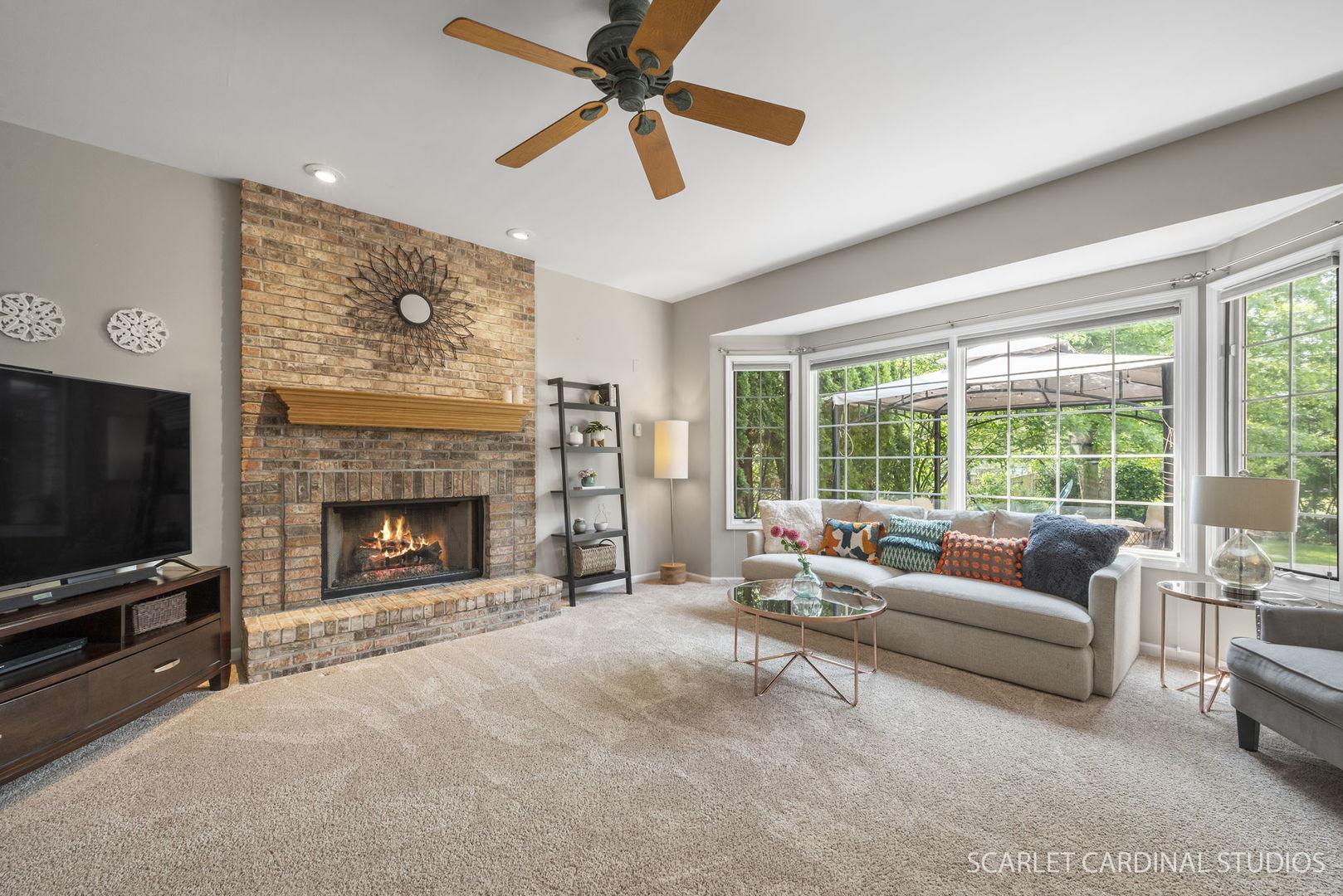 2632 Sweetbroom Road Naperville, IL 60564 - Photo 6 of 33 a living room with furniture a flat screen tv and a fireplace