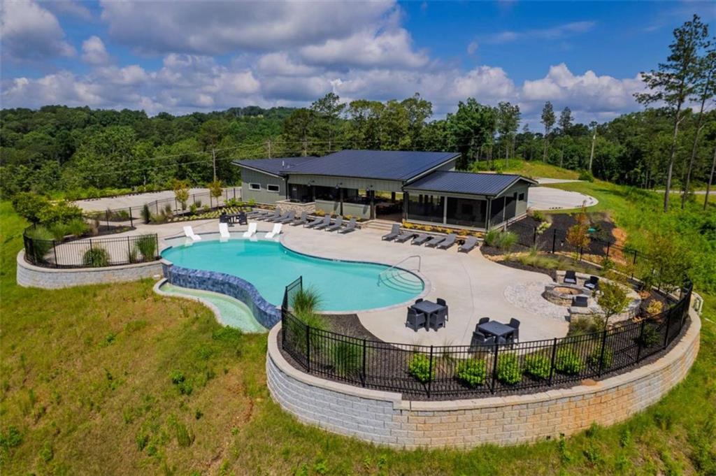 Lot 2 Blalock Mountain Road Talking Rock, GA 30175 - Photo 17 of 26 a view of a swimming pool with a yard and lake view