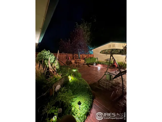 a view of swimming pool in front of residential house