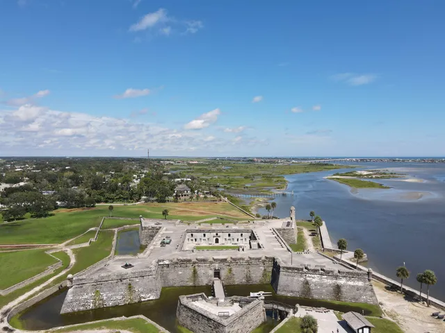 a view of swimming pool with outdoor seating and yard in back