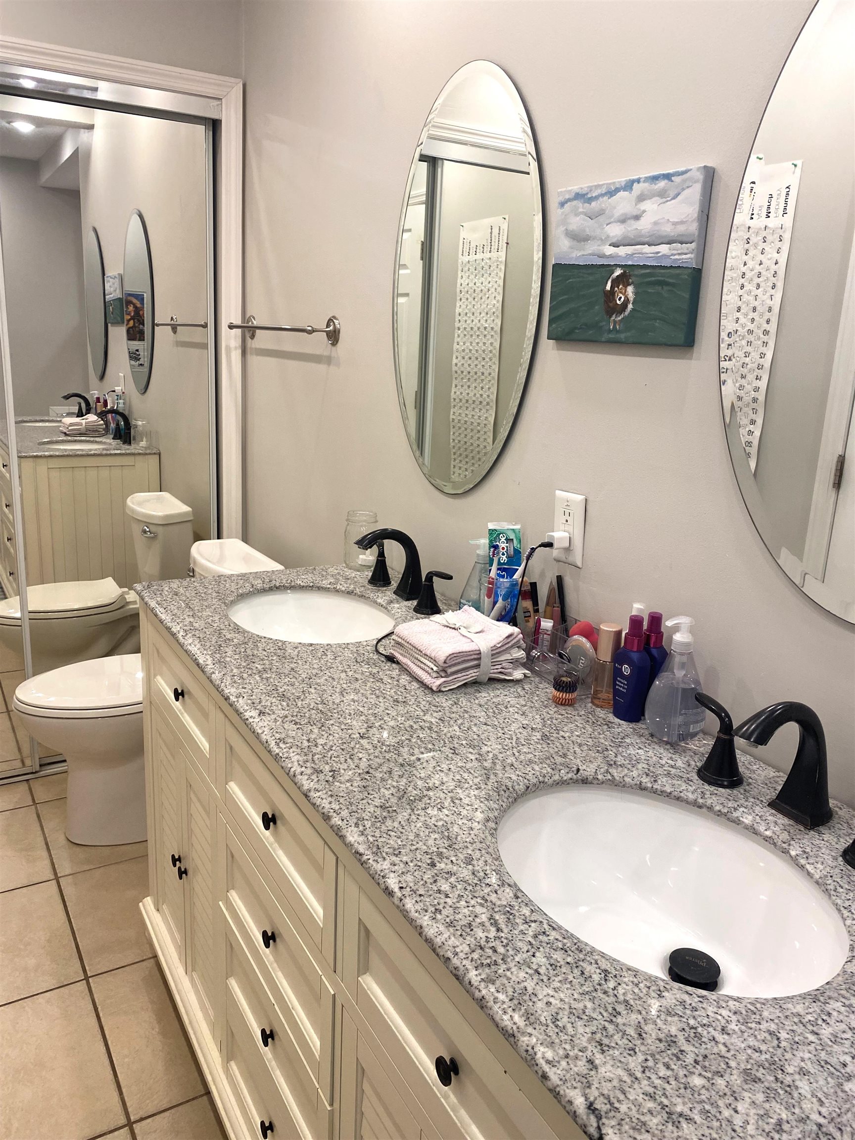 101 Flagler Boulevard, Unit D St. Augustine, FL 32080 - Photo 8 of 16 a bathroom with a granite countertop double vanity sink and a mirror