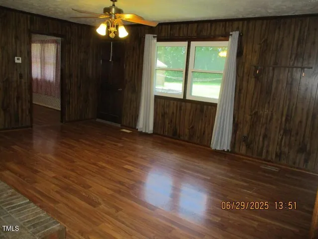 a view of wooden floor and brick walls