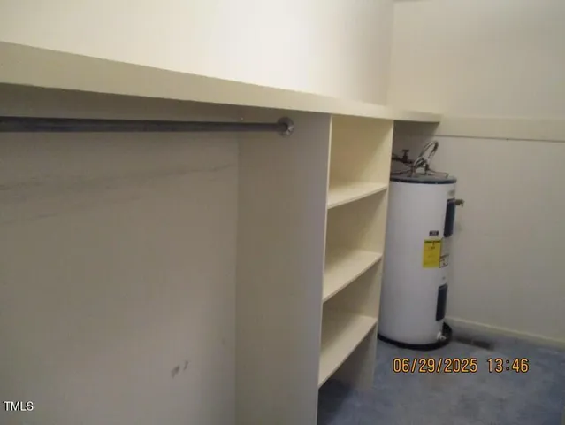 a view of a field and trees in the background