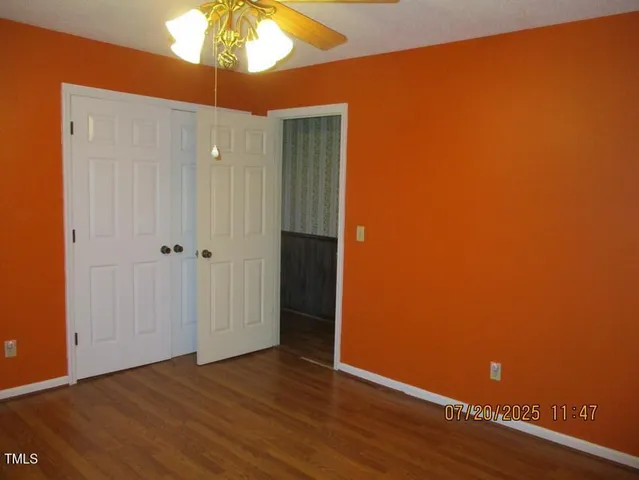 a front view of a house with yard and green space