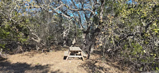 a bench sitting in middle of a field